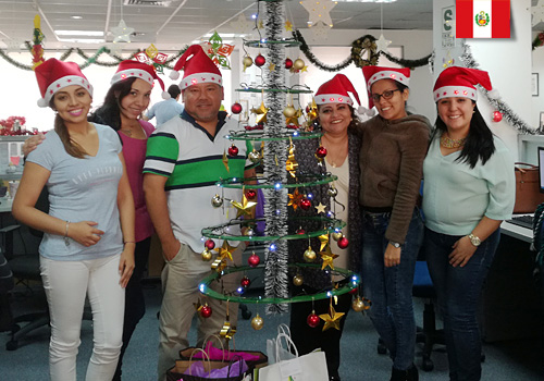 How We Celebrate Christmas in Sanitas Peru Group people at Christmas